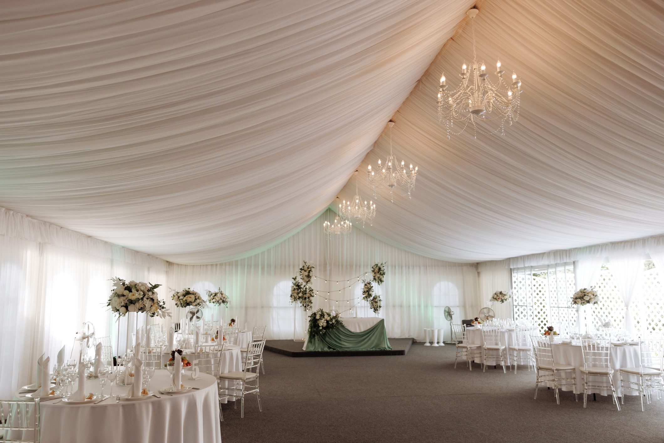 Decorated wedding hall with draped ceiling